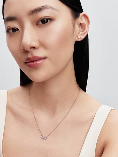 Bow 14k rose gold-plated stud earrings with clear cubic zirconia